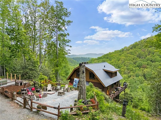a aerial view of a house with a yard