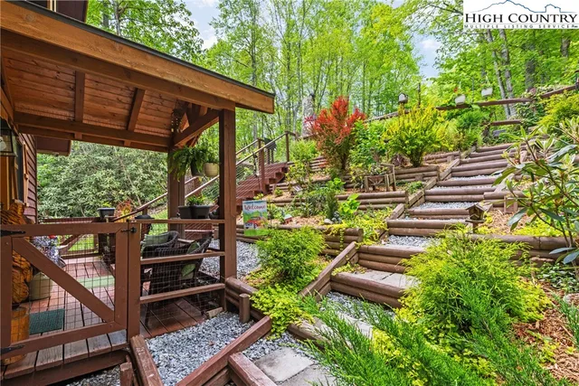 a view of a backyard with sitting area