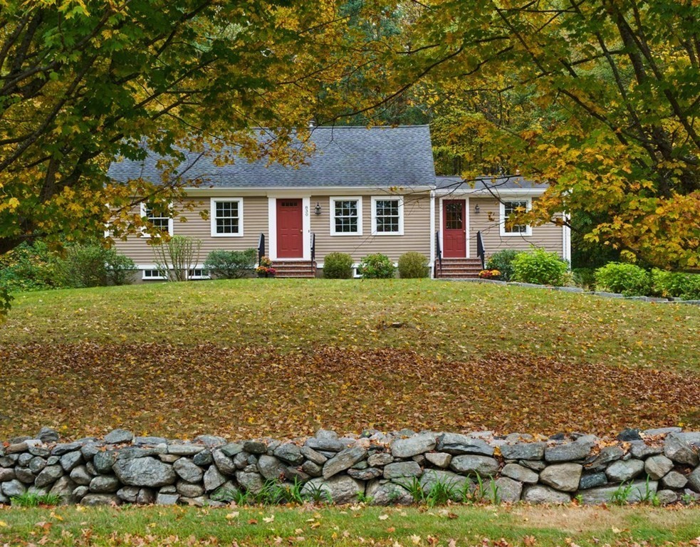 830 Liberty Square Road Boxborough, MA 01719 - Photo 1 of 40 a front view of a house with a garden