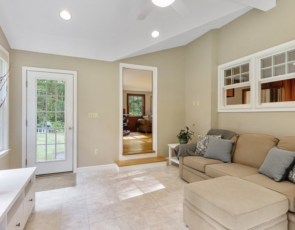 830 Liberty Square Road Boxborough, MA 01719 - Photo 16 of 40 a living room with furniture and a window