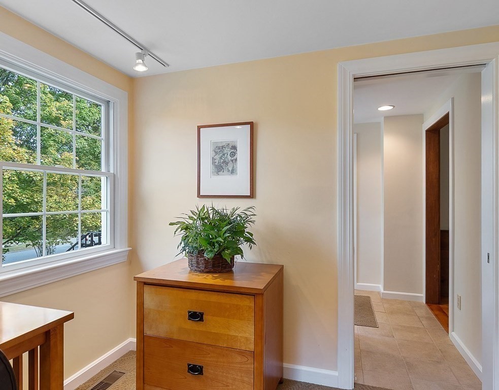 830 Liberty Square Road Boxborough, MA 01719 - Photo 18 of 40 a room with a window and a potted plant