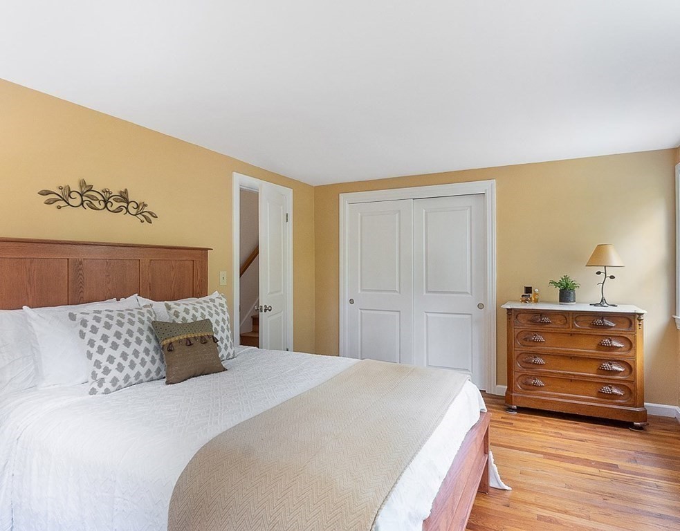 830 Liberty Square Road Boxborough, MA 01719 - Photo 22 of 40 a bedroom with a bed and a dresser
