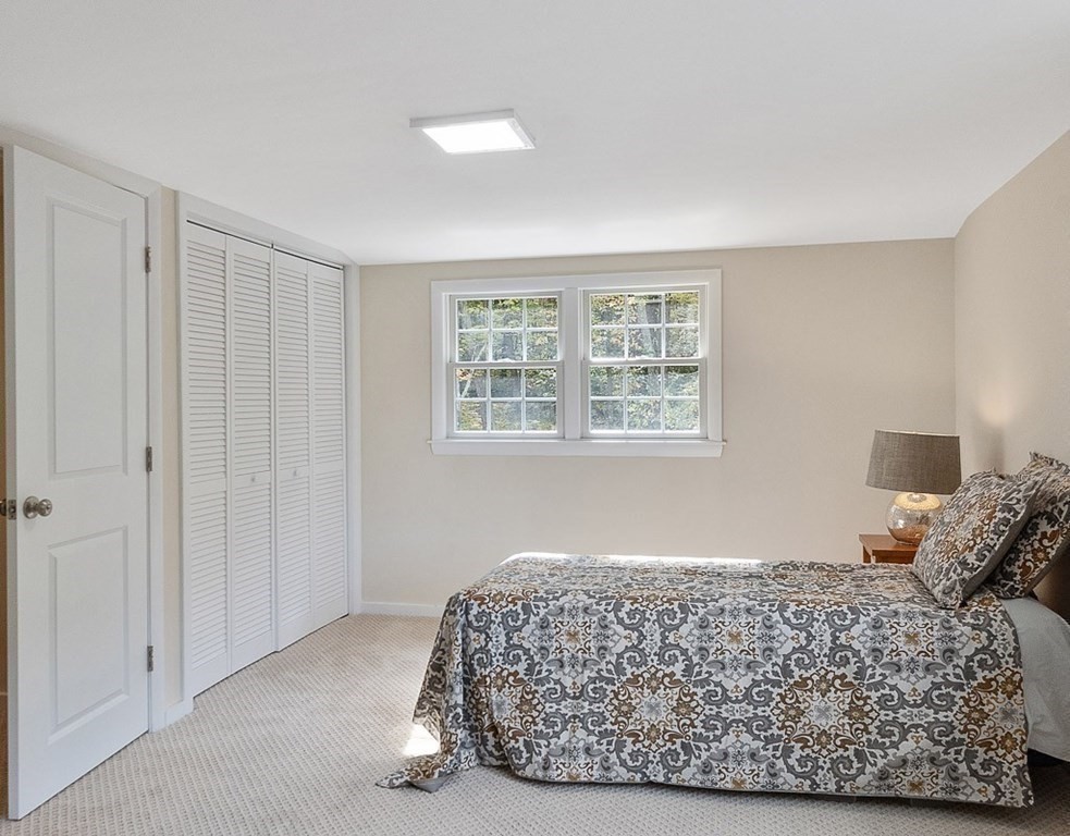 830 Liberty Square Road Boxborough, MA 01719 - Photo 24 of 40 a bedroom with a bed and a window