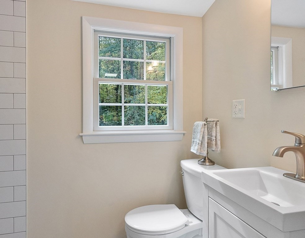 830 Liberty Square Road Boxborough, MA 01719 - Photo 27 of 40 a bathroom with a toilet sink and window