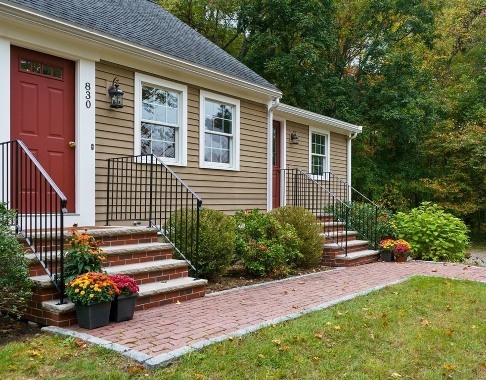 830 Liberty Square Road Boxborough, MA 01719 - Photo 30 of 40 a front view of a house with a yard