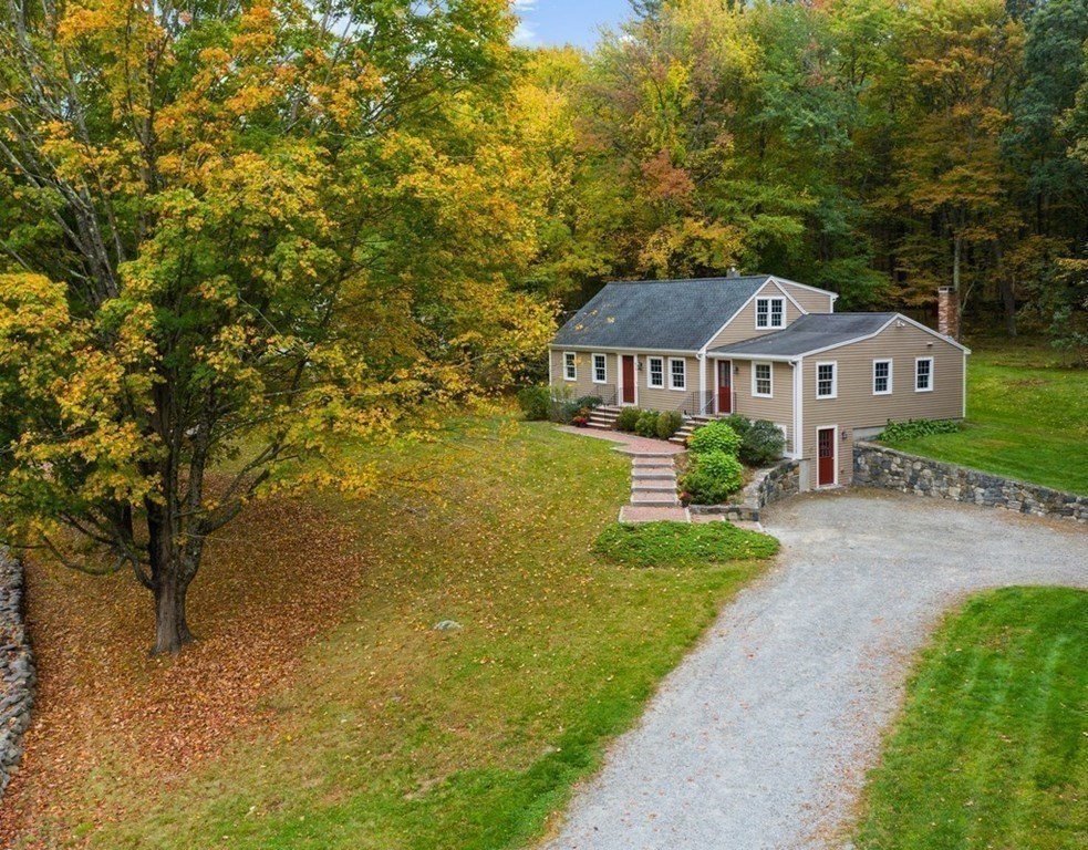 830 Liberty Square Road Boxborough, MA 01719 - Photo 33 of 40 a front view of a house with a yard