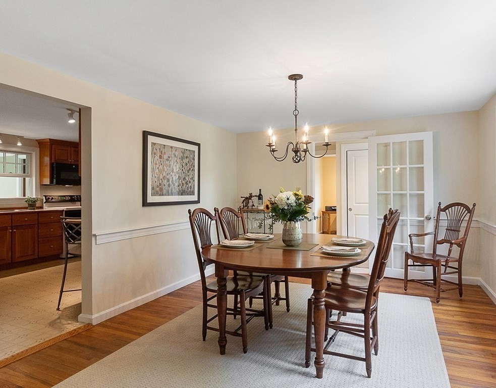 830 Liberty Square Road Boxborough, MA 01719 - Photo 5 of 40 a view of a dining room with furniture and wooden floor