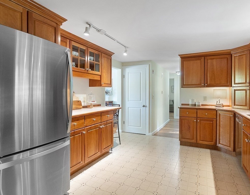 830 Liberty Square Road Boxborough, MA 01719 - Photo 9 of 40 a kitchen with stainless steel appliances granite countertop a refrigerator and a stove