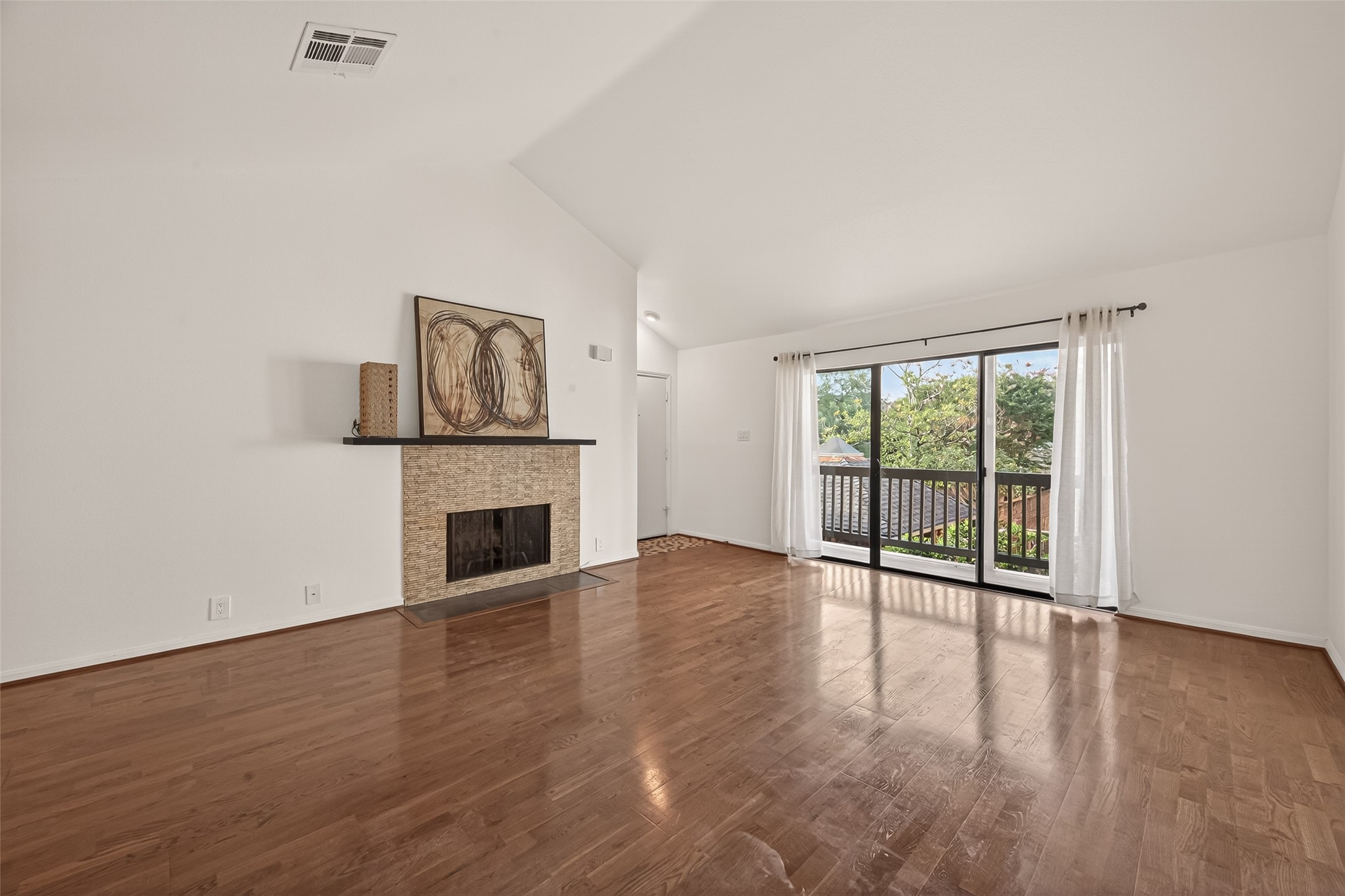 2829 Timmons Lane, Unit 144 Houston, TX 77027 - Photo 4 of 41 Sit by the glow of the living room fireplace for added ambiance or simply watch a classic movie.
