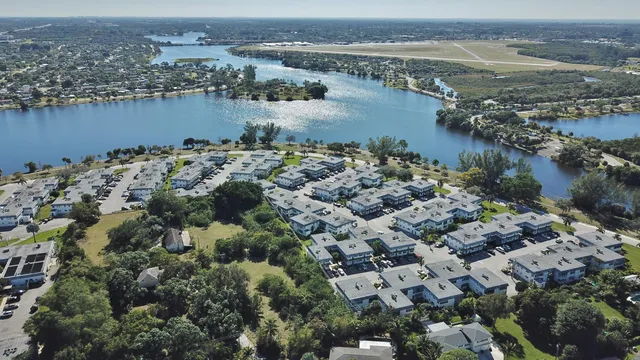 an aerial view of a city with lake view