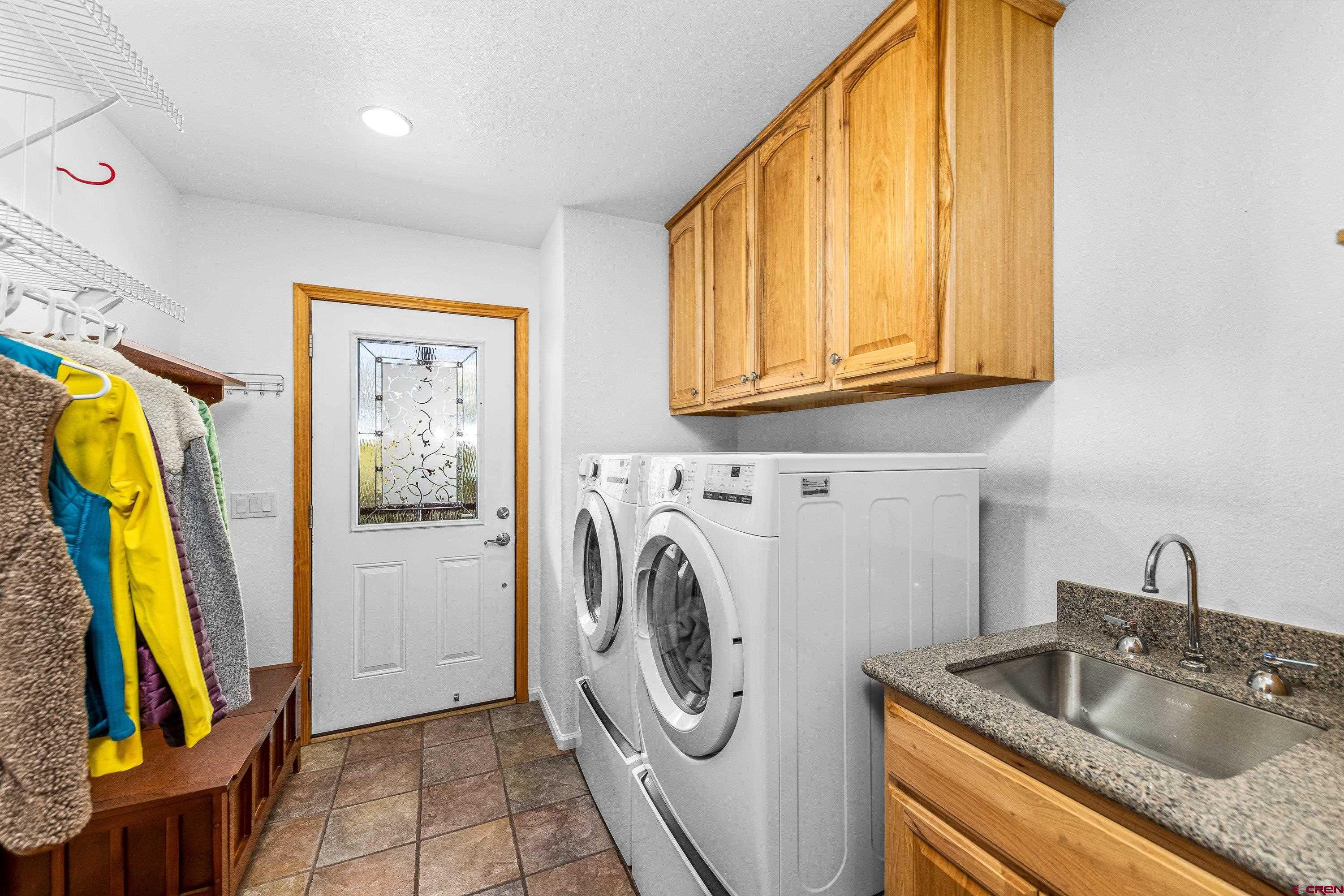 180 Ridge Road Cimarron, CO 81220 - Photo 16 of 42 a utility room with dryer and washer
