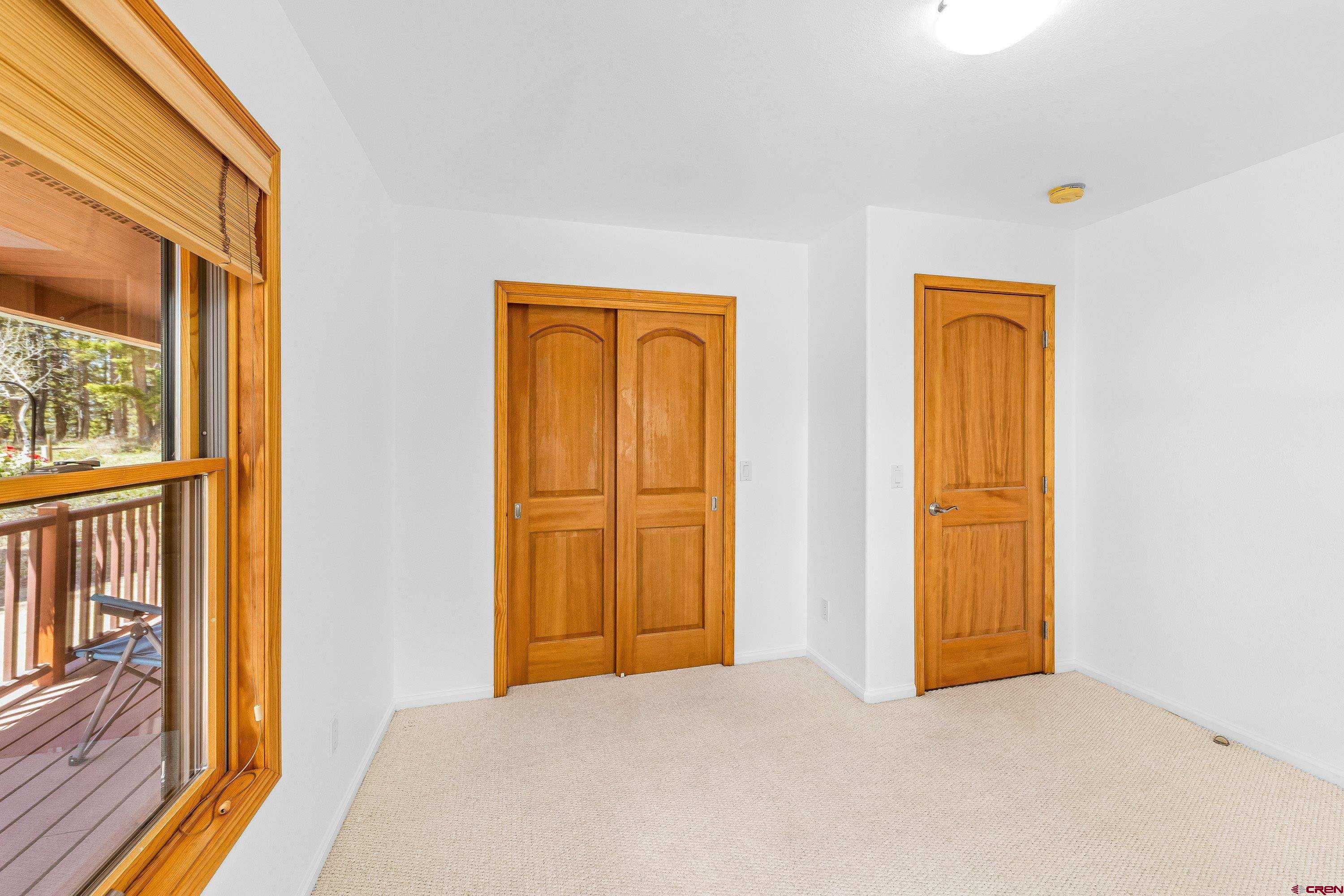 180 Ridge Road Cimarron, CO 81220 - Photo 18 of 42 a view of an empty room with glass door
