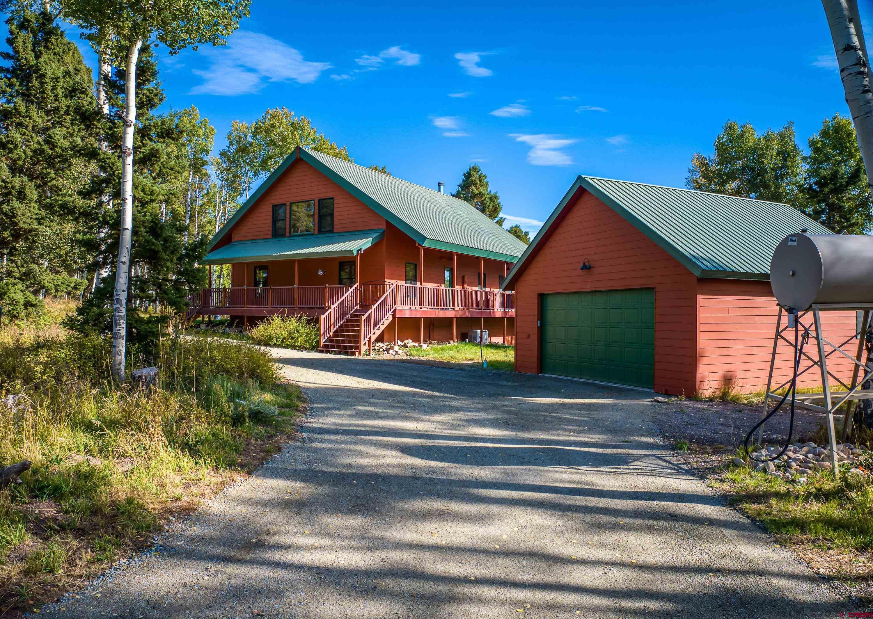 180 Ridge Road Cimarron, CO 81220 - Photo 2 of 42 a front view of house with yard