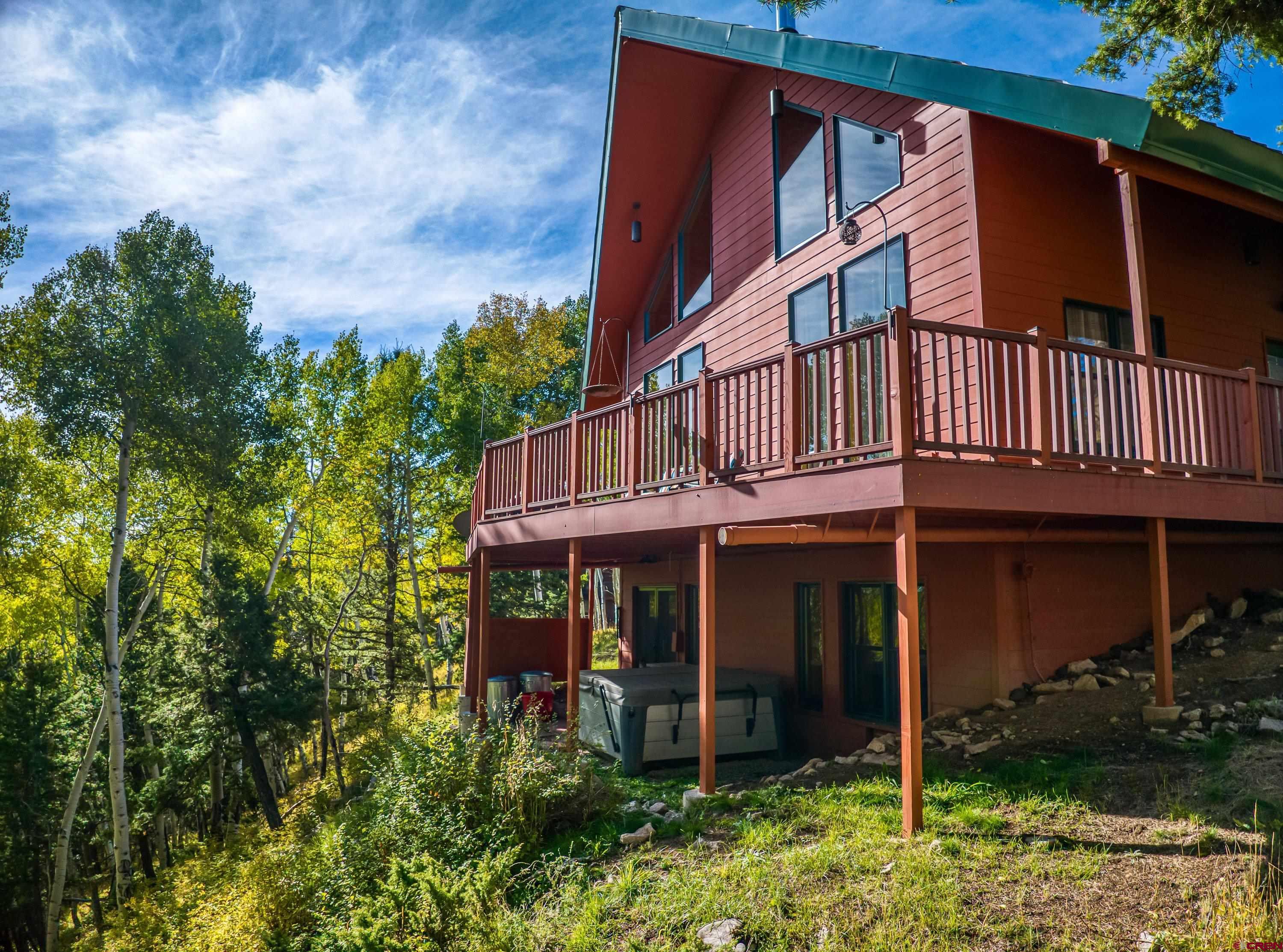 180 Ridge Road Cimarron, CO 81220 - Photo 3 of 42 front view of a house with a small yard