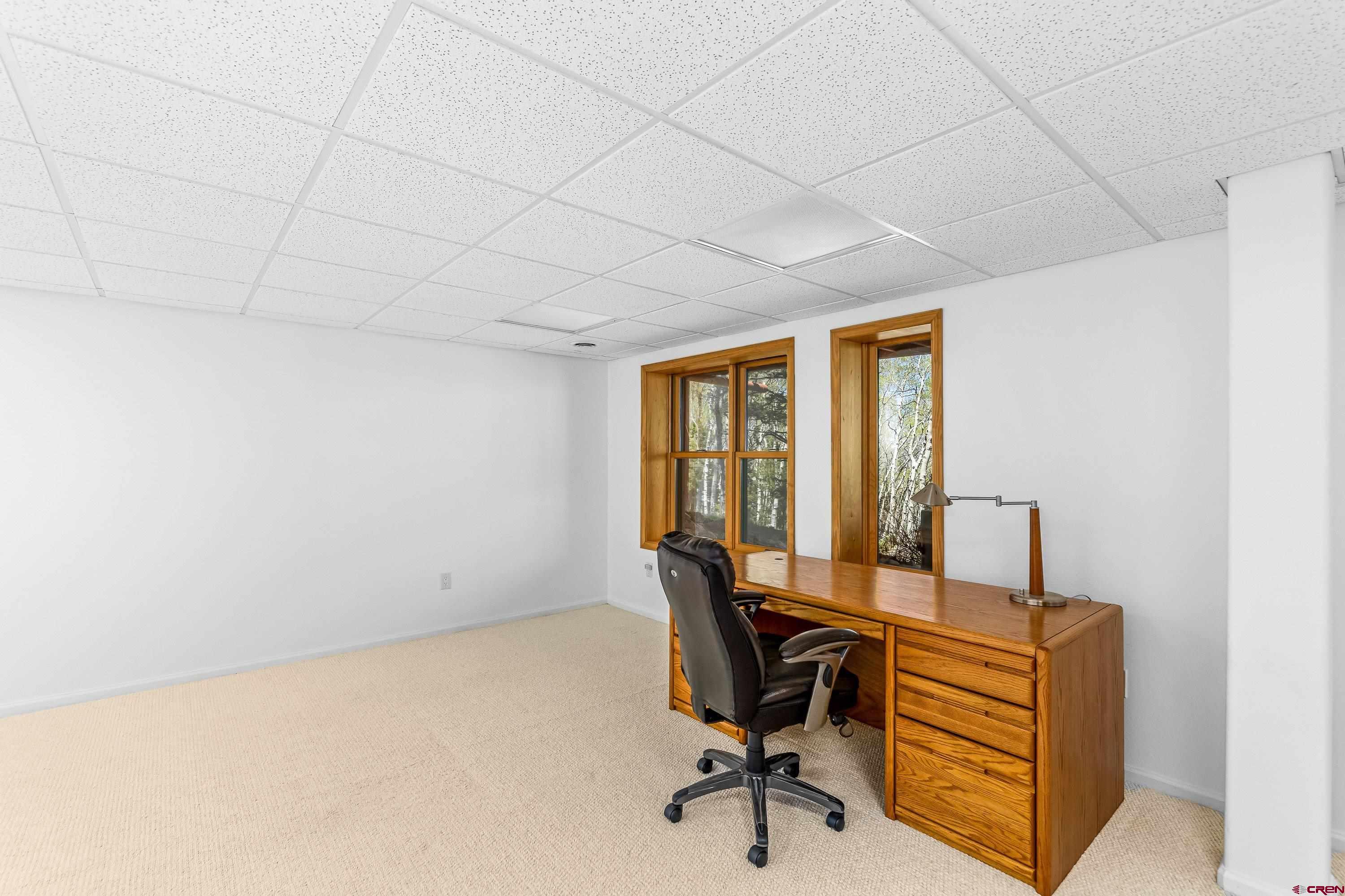 180 Ridge Road Cimarron, CO 81220 - Photo 35 of 42 a view of a workspace with furniture and a window