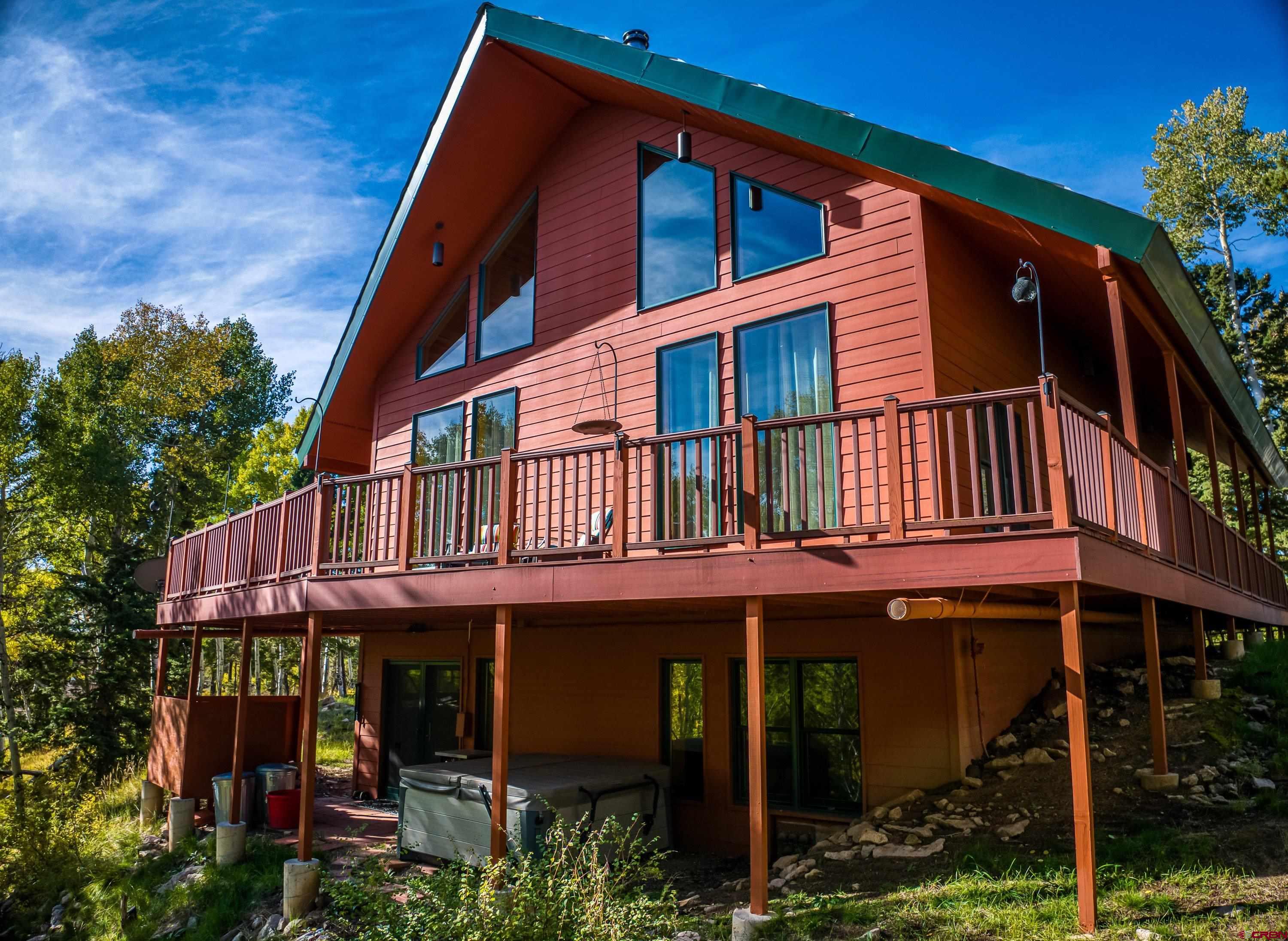 180 Ridge Road Cimarron, CO 81220 - Photo 4 of 42 a view of a house with a balcony