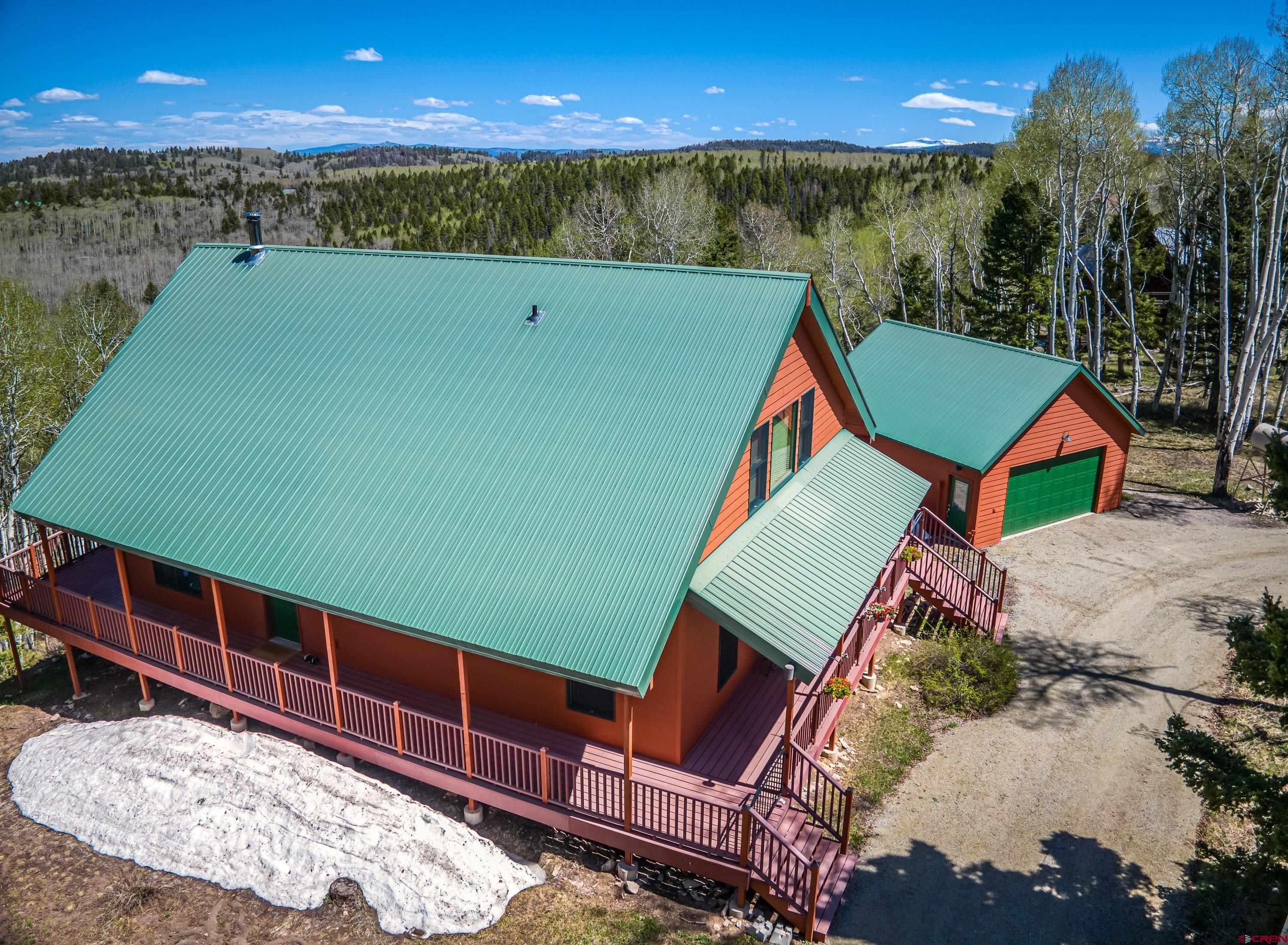 180 Ridge Road Cimarron, CO 81220 - Photo 41 of 42 a view of swimming pool with seating area and yard in back