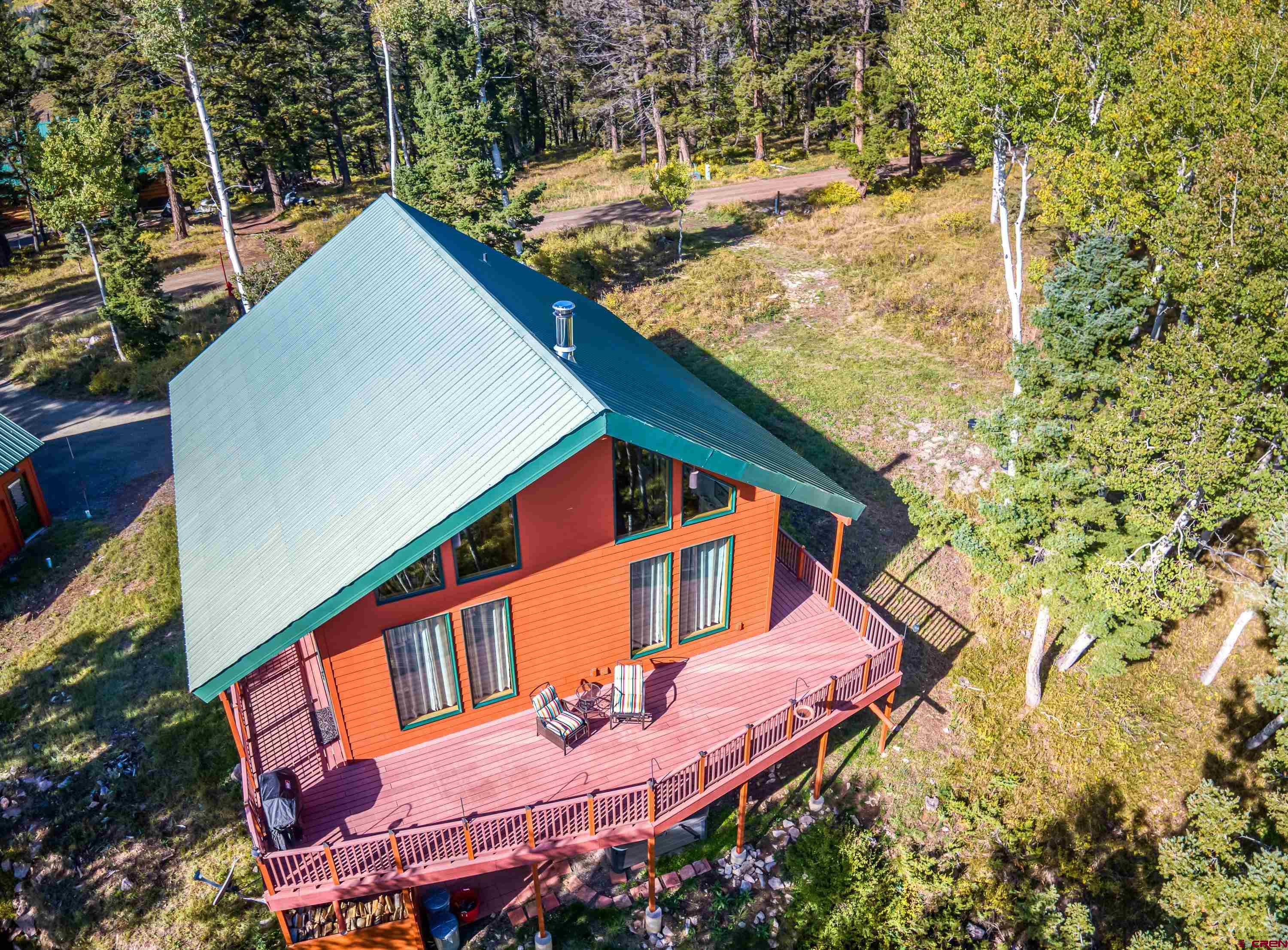 180 Ridge Road Cimarron, CO 81220 - Photo 6 of 42 a backyard of a house with seating space
