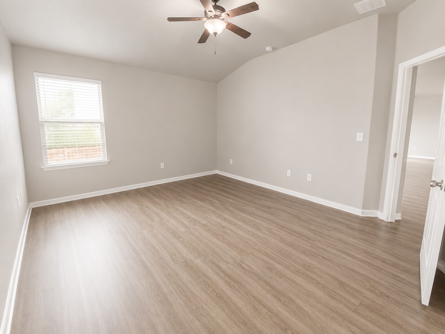 228 Avalanche Avenue Georgetown, TX 78626 - Photo 9 of 16 an empty room with wooden floor and windows