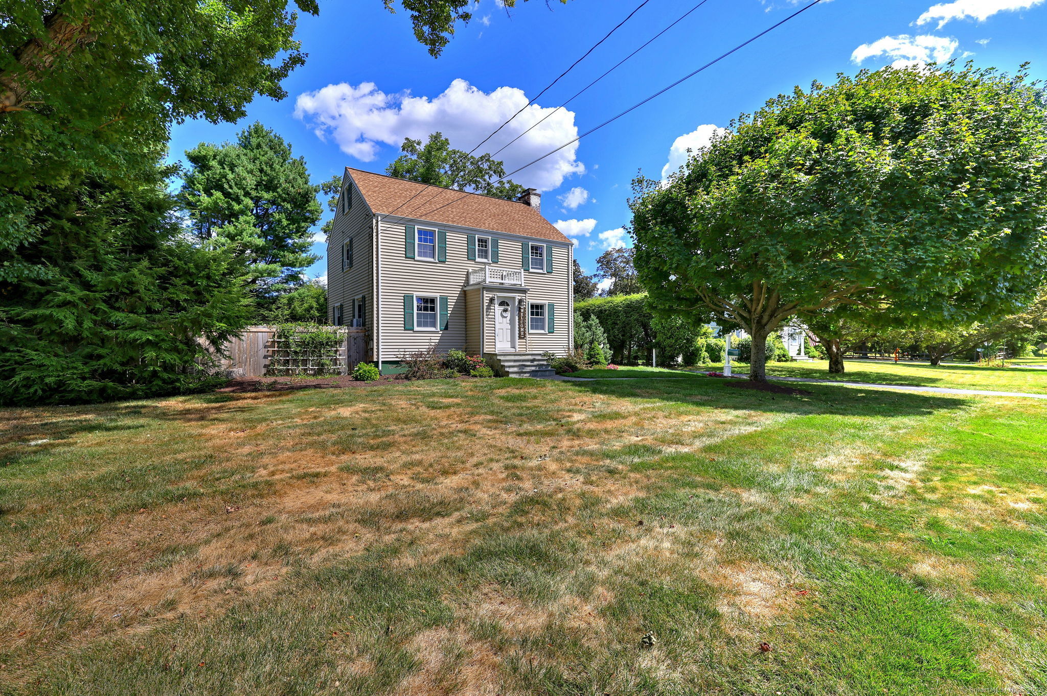 6020 Main Street Trumbull, CT 06611 - Photo 1 of 1 a front view of a house with a yard