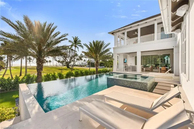 a view of a backyard with a patio and wooden floor
