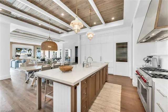 a bathroom with a bathtub sink mirror and toilet