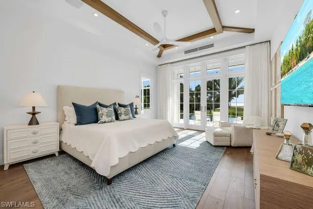 a bathroom with a granite countertop sink toilet a mirror and shower