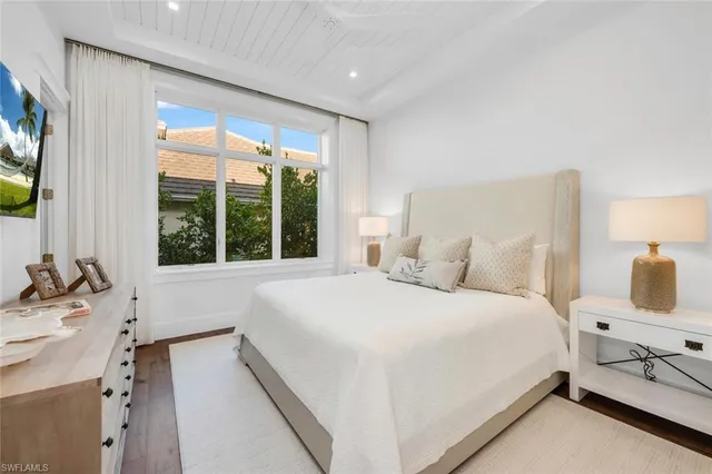 a view of a swimming pool with a patio and a yard