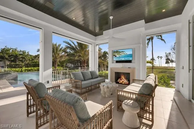 a view of living room with furniture and a large window