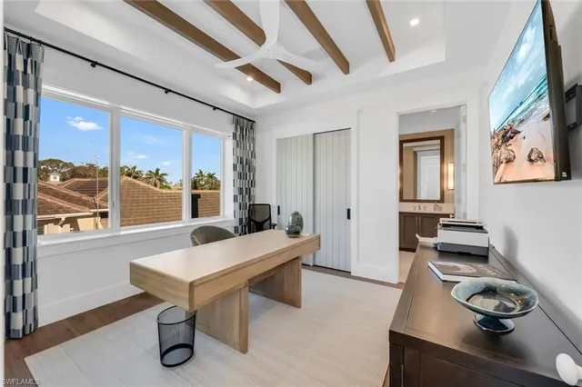 a spacious bathroom with a double vanity sink mirror and bathtub