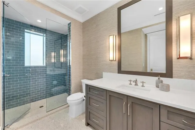 a bedroom with a bed a table and chair