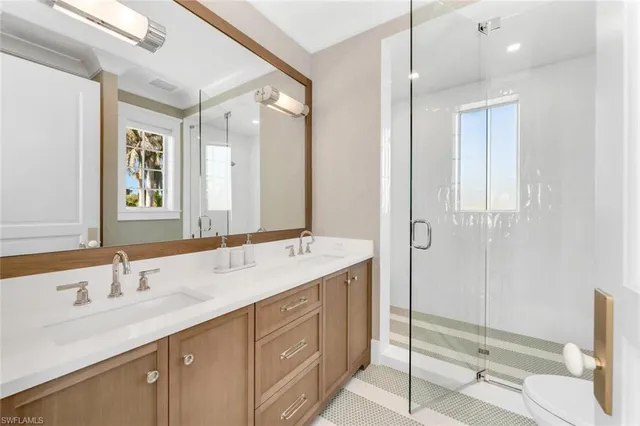 a view of a patio with table and chairs and potted plants