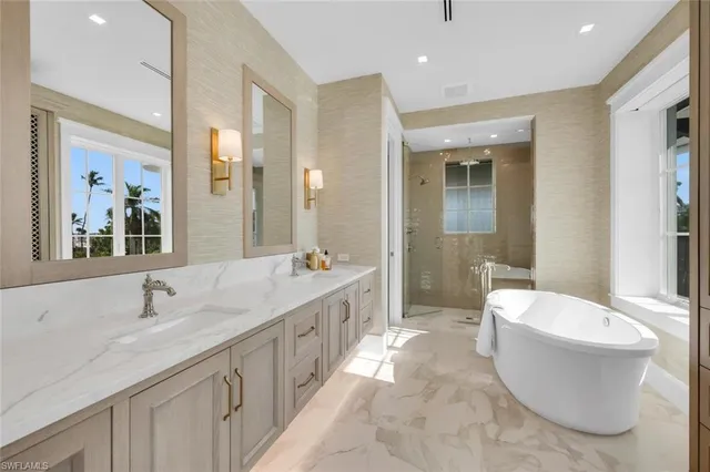 a view of a house with a swimming pool and sitting area