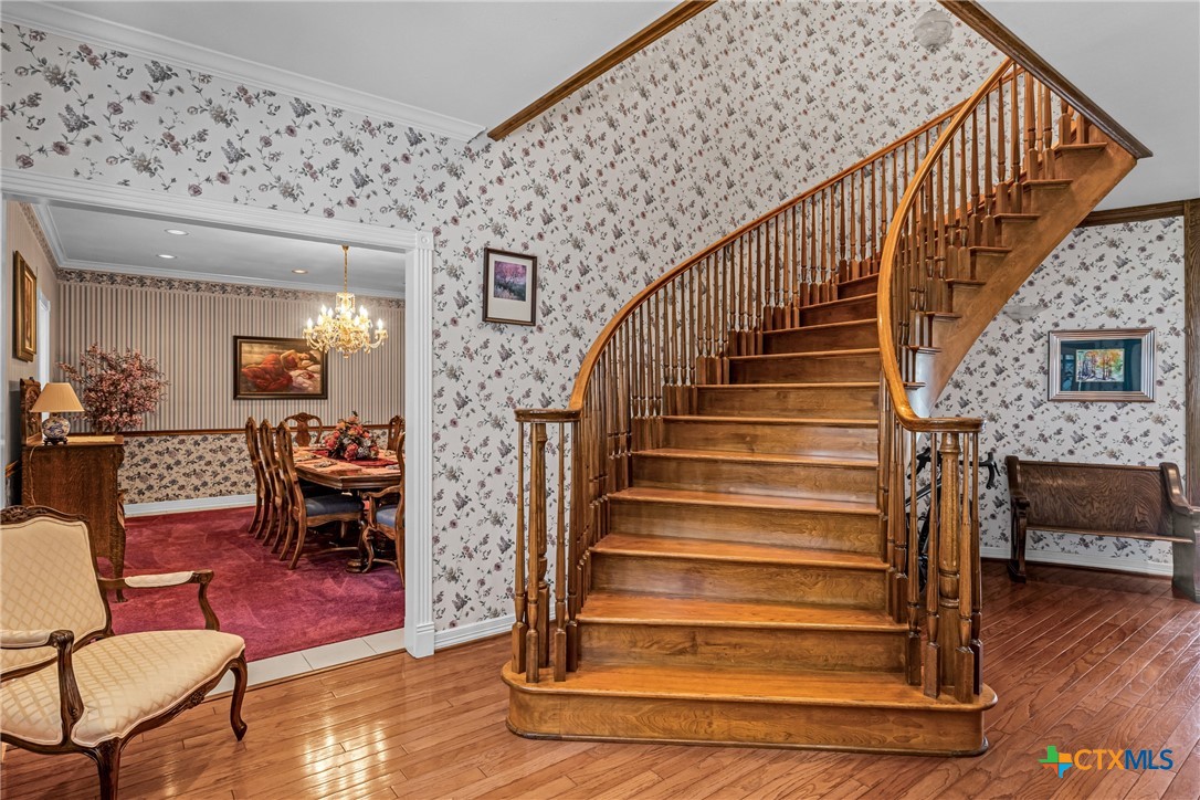 10299 Paddy Hamilton Road Belton, TX 76513 - Photo 14 of 46 a view of entryway livingroom and hall with wooden floor