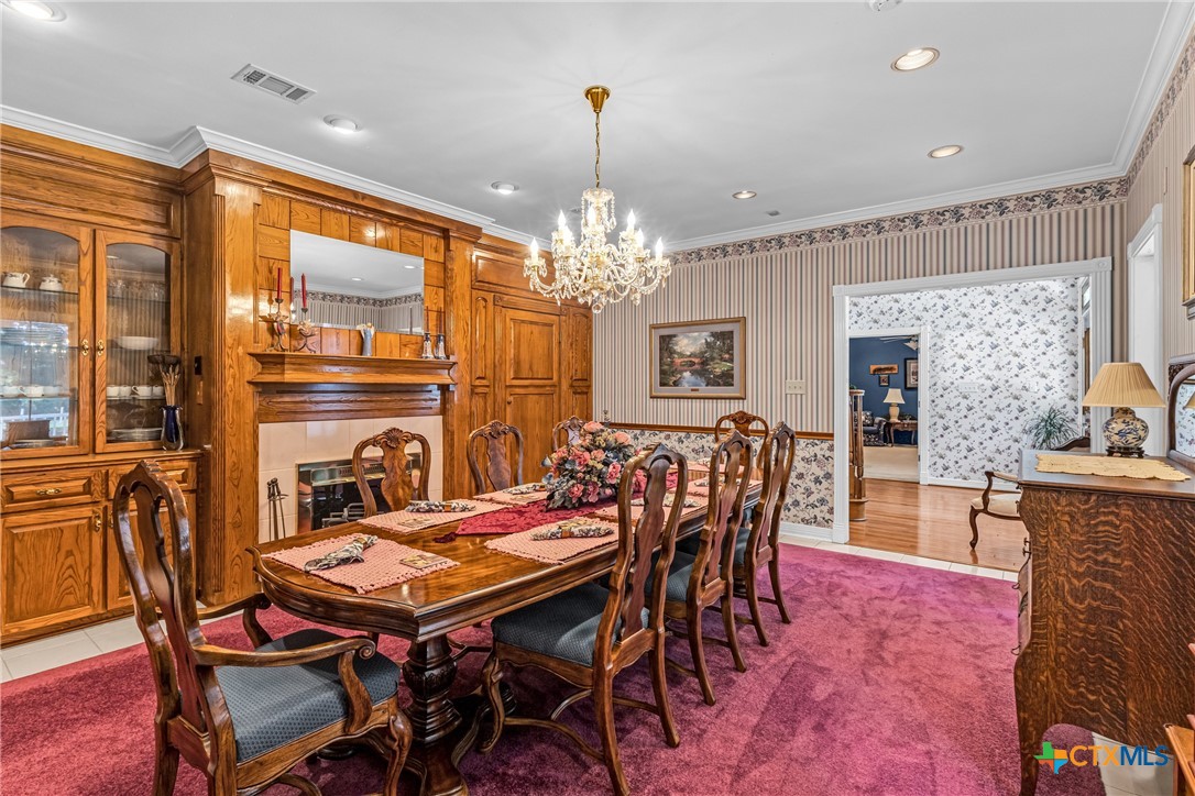 10299 Paddy Hamilton Road Belton, TX 76513 - Photo 15 of 46 a view of a dining room with furniture window and wooden floor