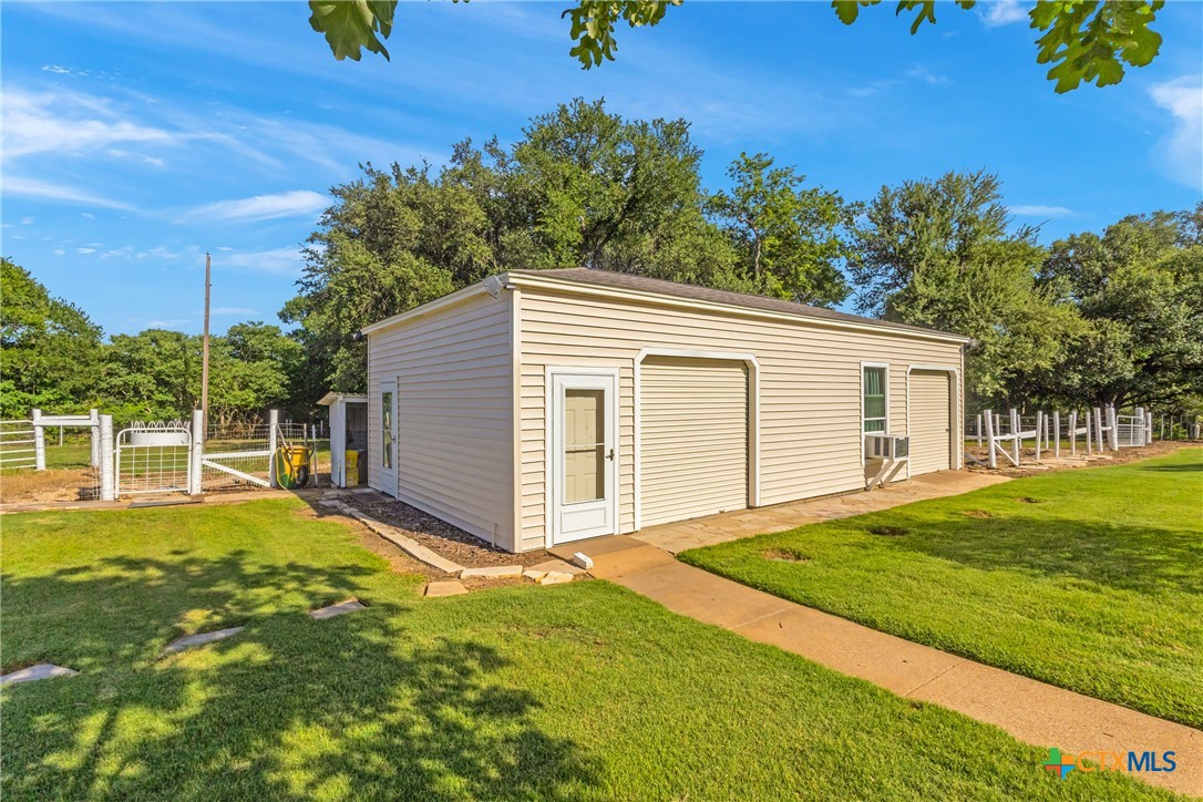 10299 Paddy Hamilton Road Belton, TX 76513 - Photo 42 of 46 a view of a backyard with a garden and tree