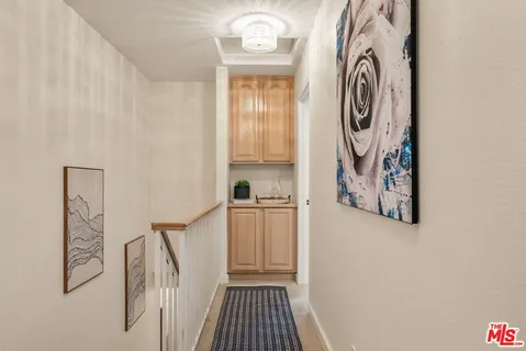 a view of a storage and utility room with wall dryer