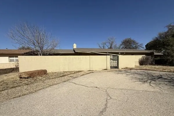 a view of a house with a snow in the yard