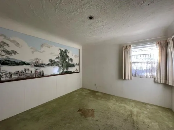 a view of livingroom with furniture and window
