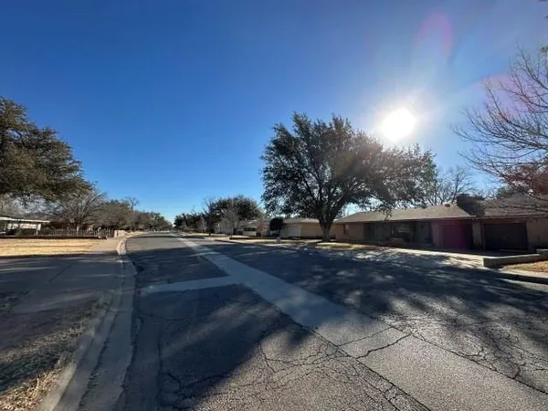 a view of street with view of house