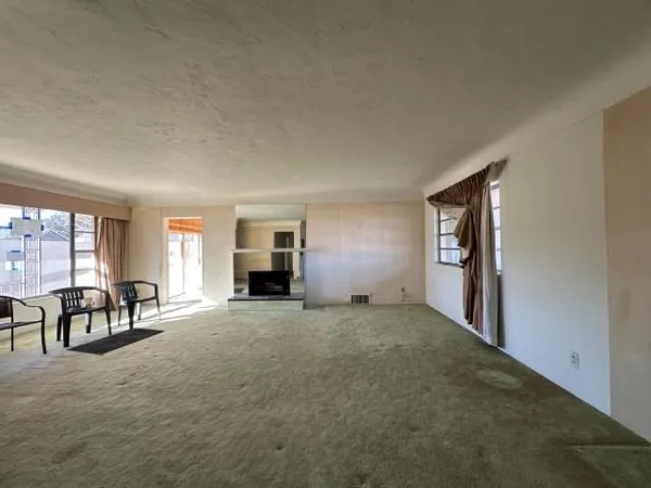 a view of a livingroom with furniture and windows