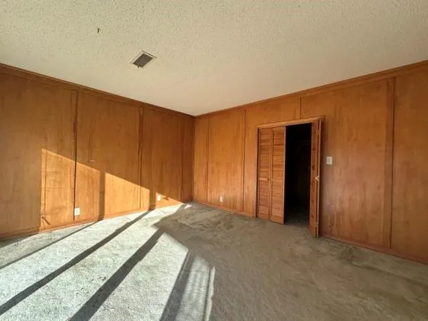 a view of a room with large windows