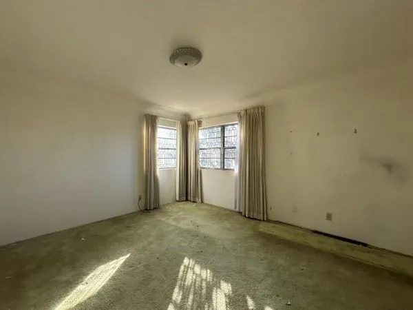 an empty room with windows