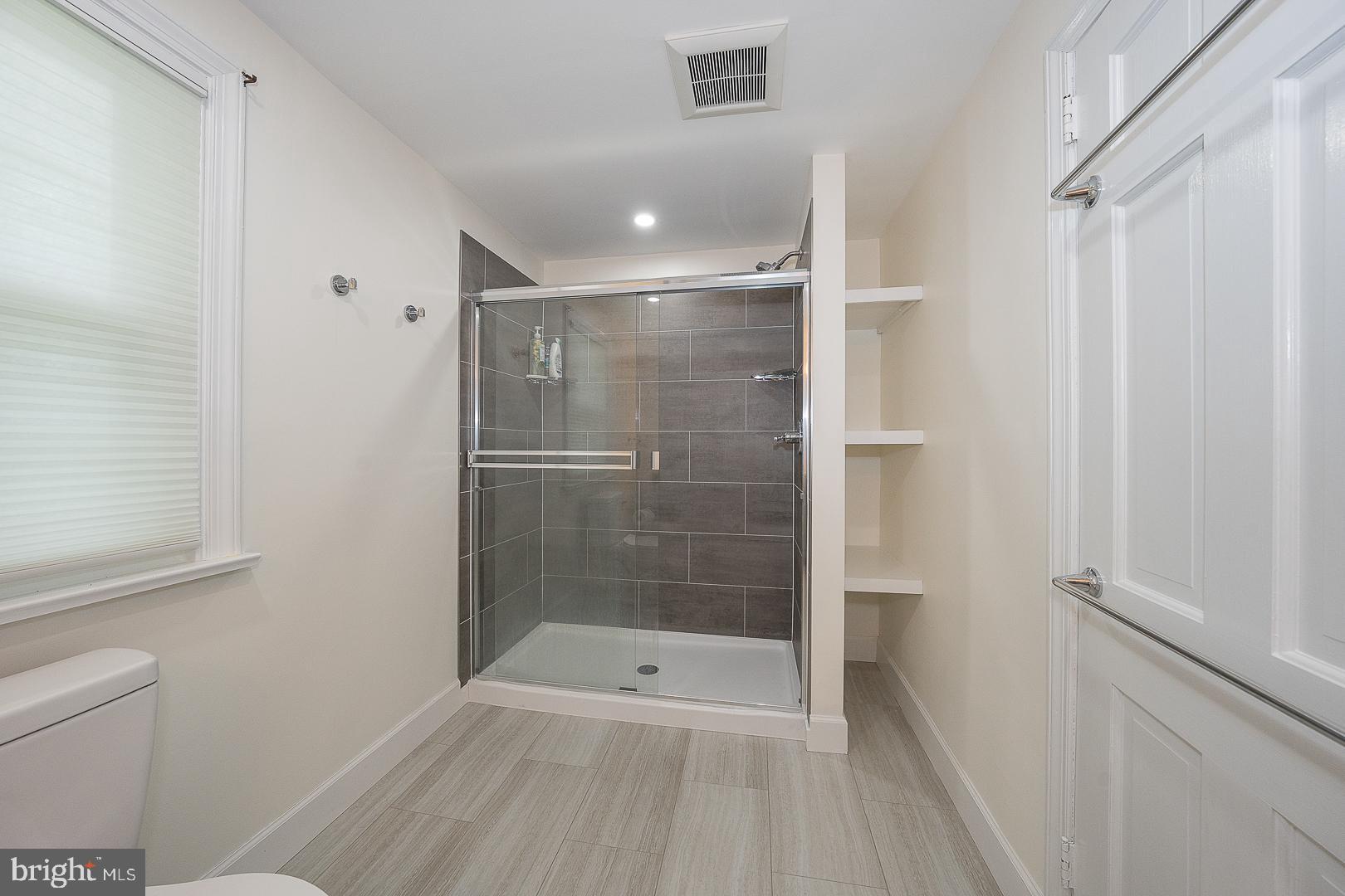 538 Conestoga Road Villanova, PA 19085 - Photo 22 of 39 a bathroom with a shower and a toilet