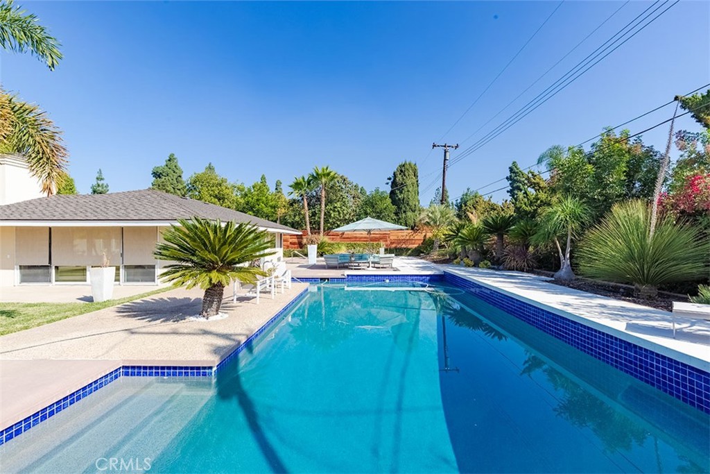 931 Rancho Circle Fullerton, CA 92835 - Photo 2 of 53 a swimming pool with outdoor seating and yard