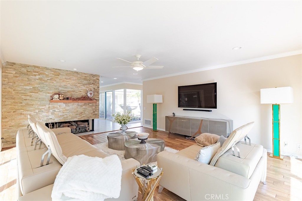 931 Rancho Circle Fullerton, CA 92835 - Photo 22 of 53 a living room with furniture a flat screen tv and a fireplace
