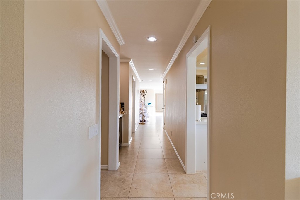 931 Rancho Circle Fullerton, CA 92835 - Photo 30 of 53 a view of a hallway with wooden shelves