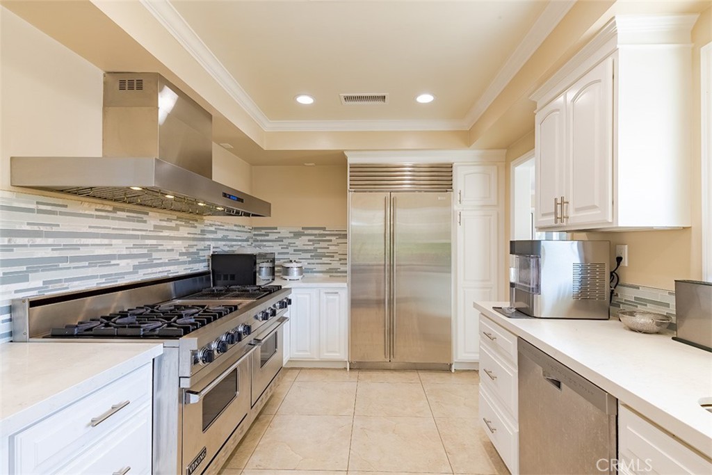 931 Rancho Circle Fullerton, CA 92835 - Photo 35 of 53 a kitchen with stainless steel appliances granite countertop a stove a refrigerator and a sink