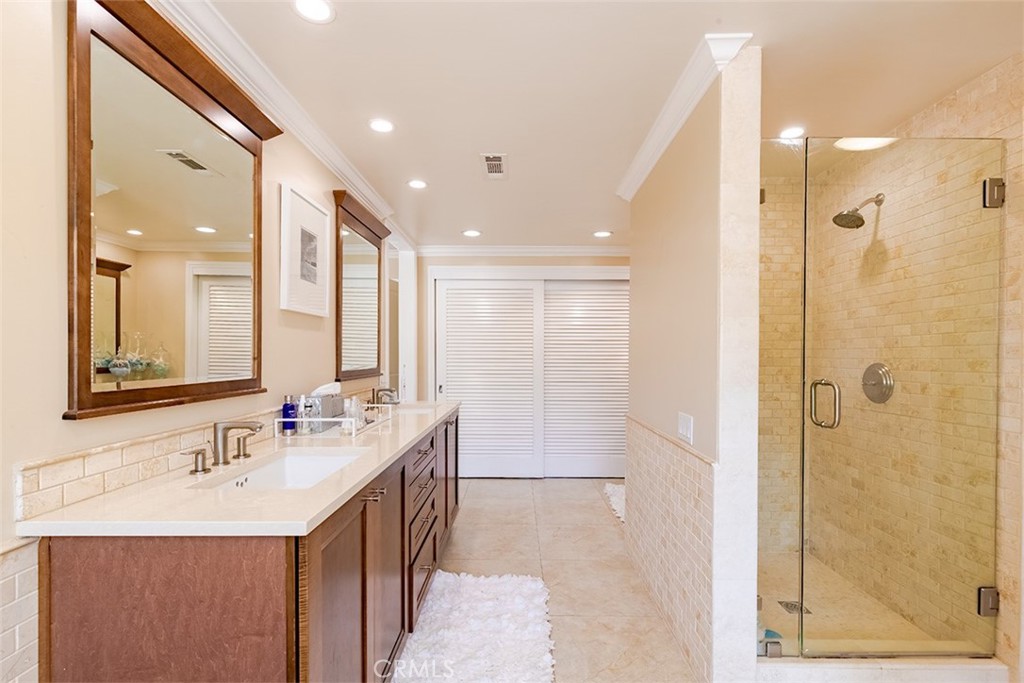 931 Rancho Circle Fullerton, CA 92835 - Photo 42 of 53 a bathroom with a double vanity sink mirror and shower
