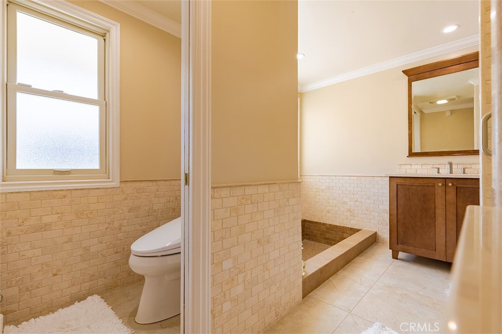 931 Rancho Circle Fullerton, CA 92835 - Photo 43 of 53 a bathroom with a toilet and a shower